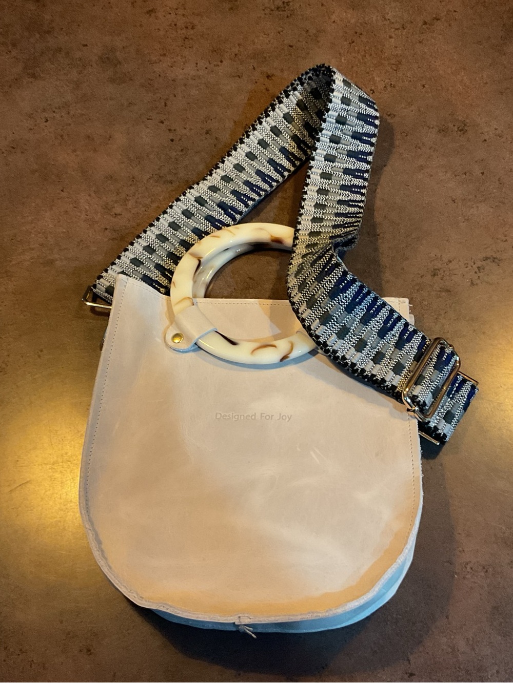Cream Leather Shoulder Bag with Tortoiseshell Ring Handle and Woven Strap